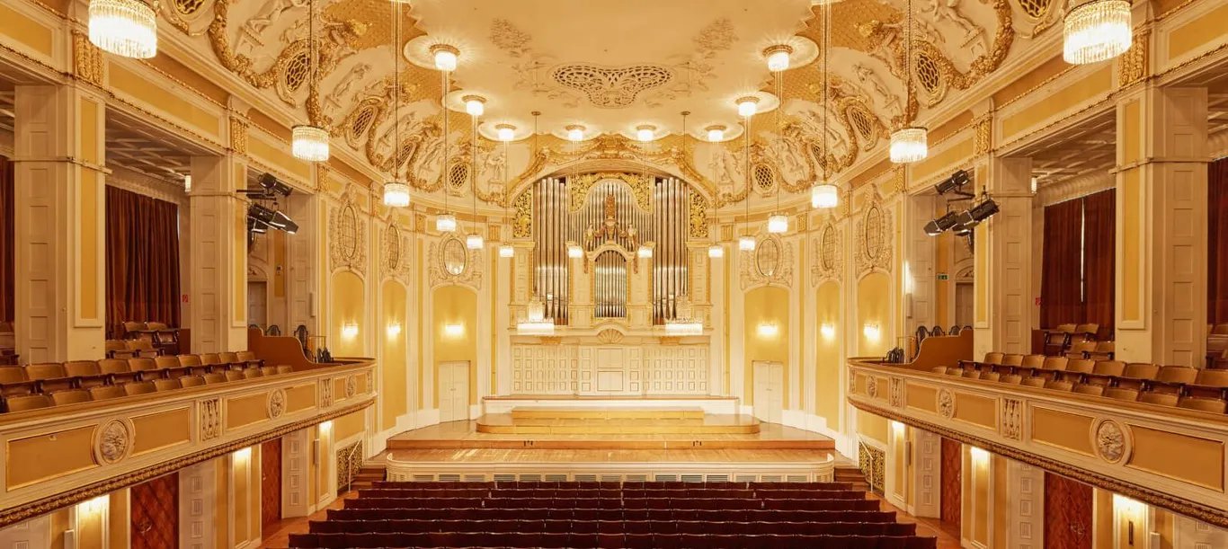 Baroque architecture, including ornate chandeliers, sets the tone for orchestral concerts, solo recitals, and symphonies with seating for up to 800 guests.